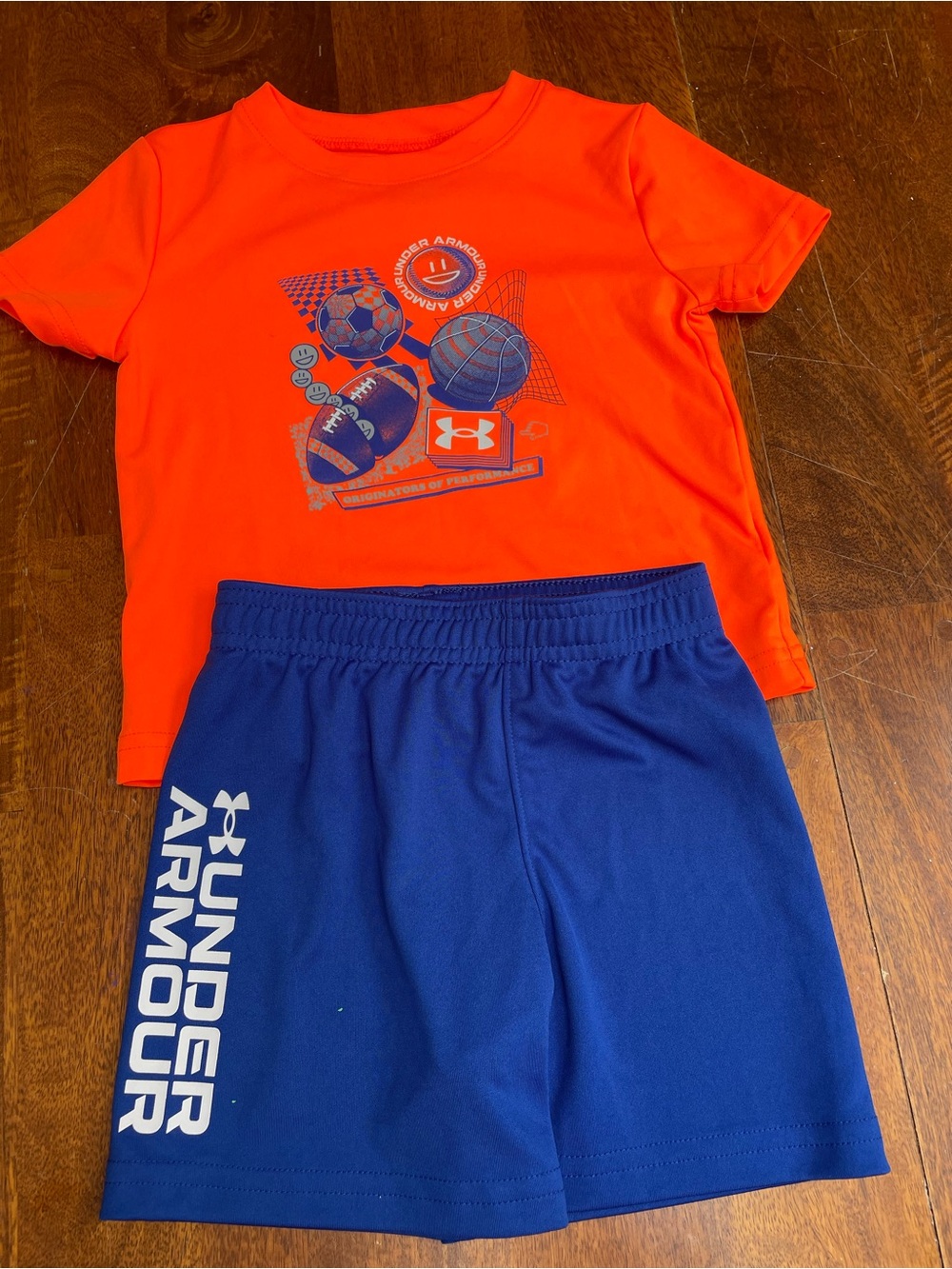 Under Armour blue shorts and neon orange sports shirt size 18 months